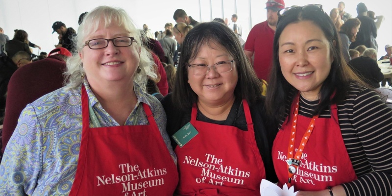 Three woman wearing art museum t-shirts